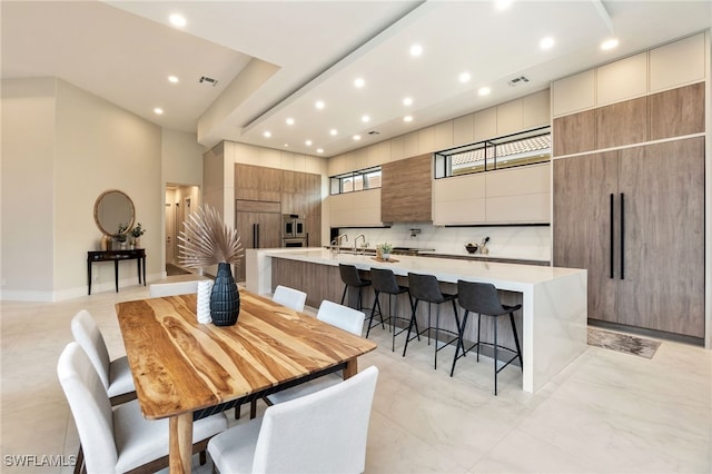 dining space featuring sink