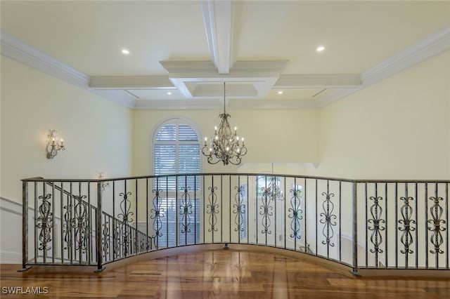 hall featuring crown molding, recessed lighting, an inviting chandelier, coffered ceiling, and beamed ceiling