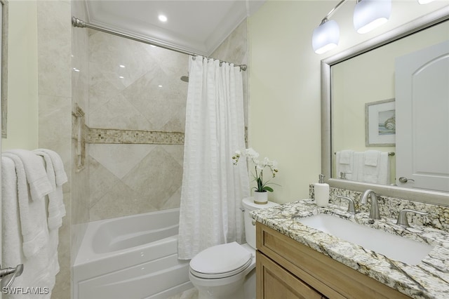 bathroom with vanity, toilet, and shower / bath combo with shower curtain