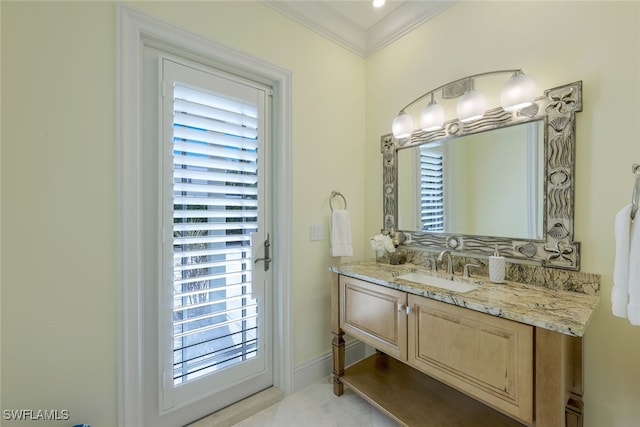 bathroom with vanity, a wealth of natural light, and crown molding