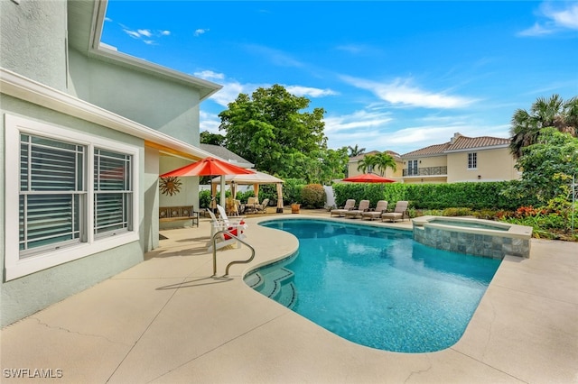 view of pool with a gazebo, a patio area, a fenced backyard, and a pool with connected hot tub