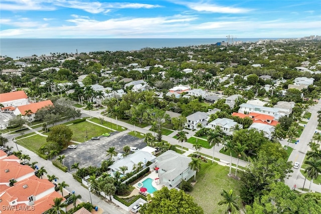 birds eye view of property featuring a water view and a residential view