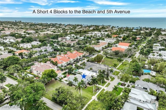 bird's eye view with a residential view and a water view