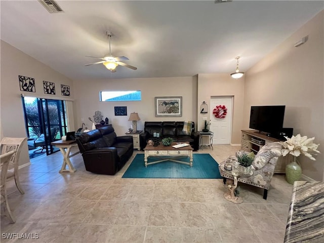 living room with ceiling fan and lofted ceiling