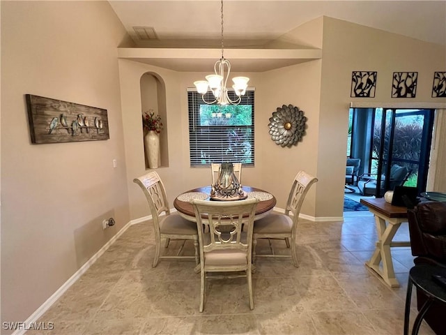 dining room featuring lofted ceiling and a notable chandelier