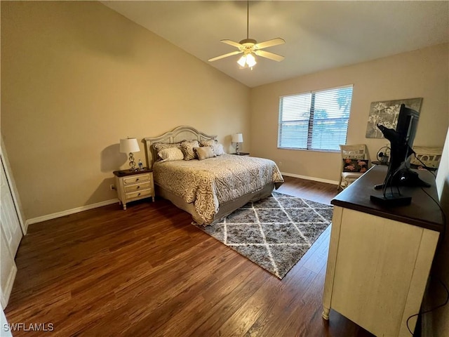 bedroom featuring ceiling fan, dark hardwood / wood-style flooring, and vaulted ceiling