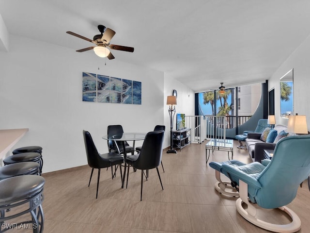 dining space featuring ceiling fan