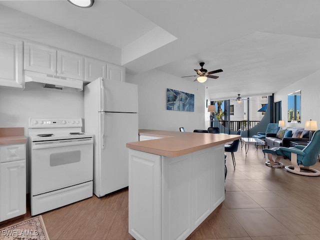 kitchen featuring ceiling fan, light tile patterned floors, white cabinets, and white appliances