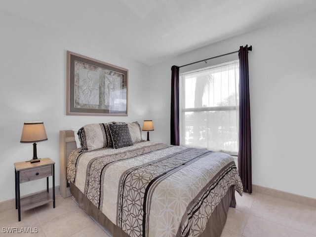 bedroom featuring light tile patterned flooring