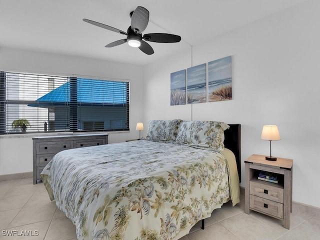 tiled bedroom with ceiling fan