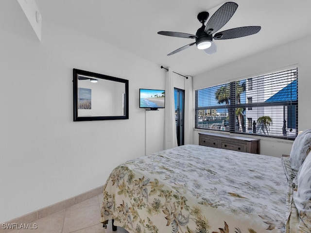 bedroom featuring ceiling fan and light tile patterned flooring