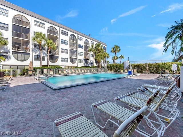 view of swimming pool with a patio