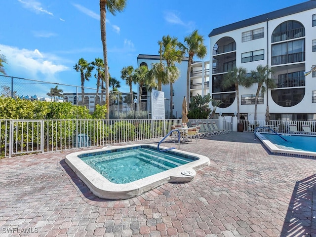 view of pool featuring a hot tub