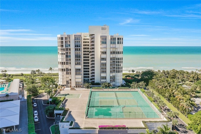 birds eye view of property with a water view