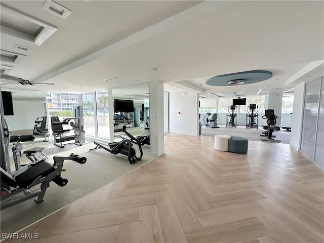 gym featuring baseboards