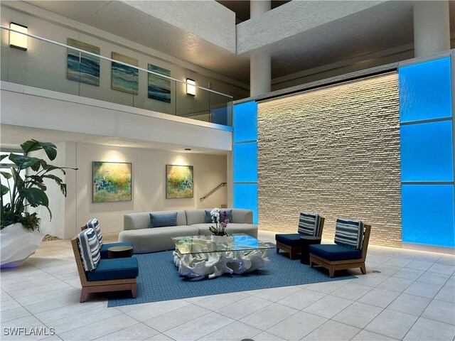 common area with a towering ceiling