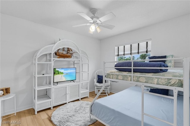 bedroom featuring hardwood / wood-style flooring and ceiling fan