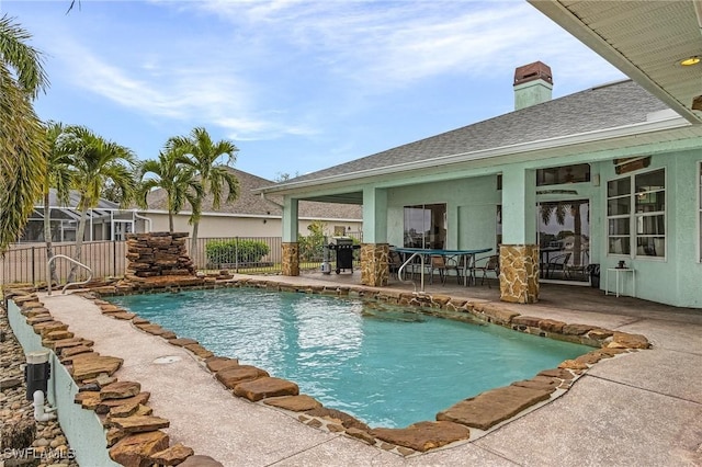 view of swimming pool featuring a fenced in pool, a patio area, fence, and area for grilling