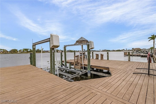 view of dock with a water view and boat lift