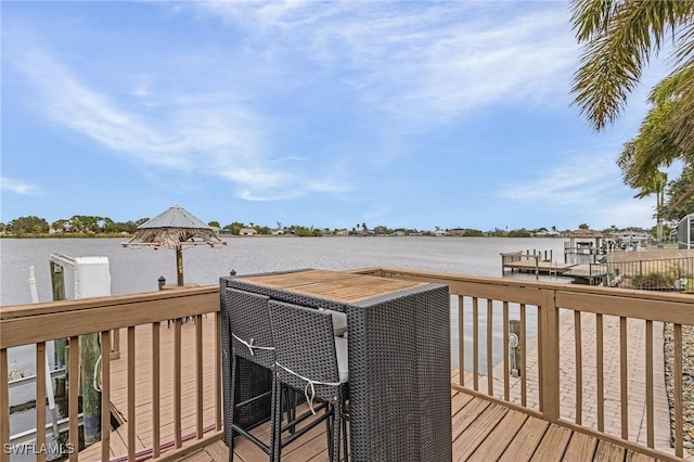 wooden deck featuring a water view