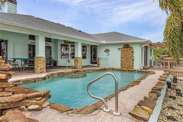 pool with a patio area