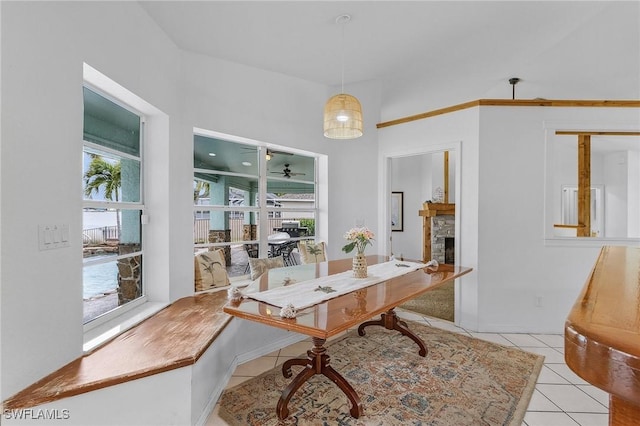 interior space with a fireplace and light tile patterned floors