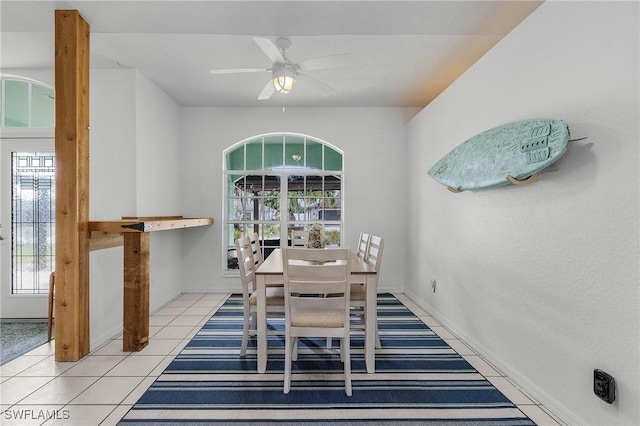 tiled dining area featuring ceiling fan