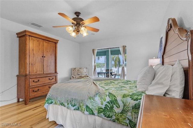 bedroom with access to outside, light hardwood / wood-style flooring, and ceiling fan