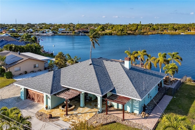 drone / aerial view with a water view