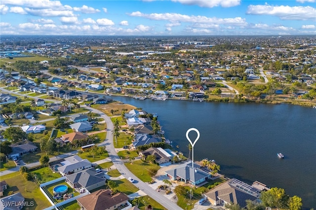 bird's eye view featuring a water view and a residential view