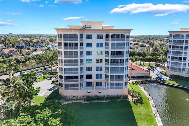 view of building exterior with a water view