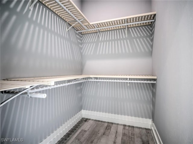 19871 Adams Rd, Fort Myers, FL 33908 - spacious closet featuring wood finished floors