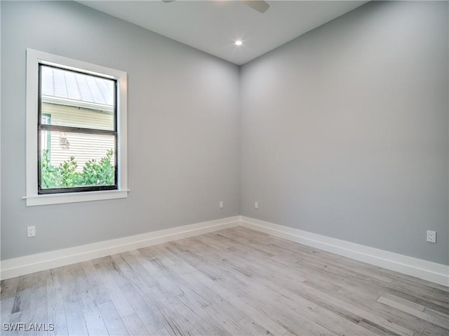 unfurnished room featuring ceiling fan and light hardwood / wood-style flooring