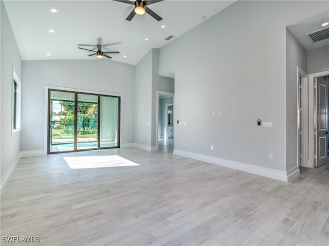 unfurnished living room featuring light wood-type flooring, high vaulted ceiling, and ceiling fan