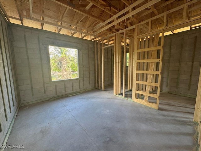 19871 Adams Rd, Fort Myers, FL 33908 - miscellaneous room with unfinished concrete floors and concrete block wall