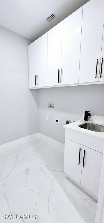 laundry area featuring washer hookup, sink, cabinets, and hookup for an electric dryer