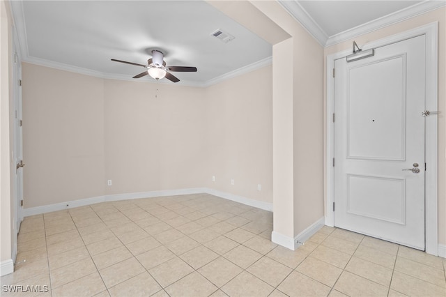 tiled spare room with ceiling fan and ornamental molding