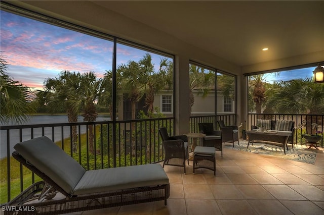 sunroom with a water view