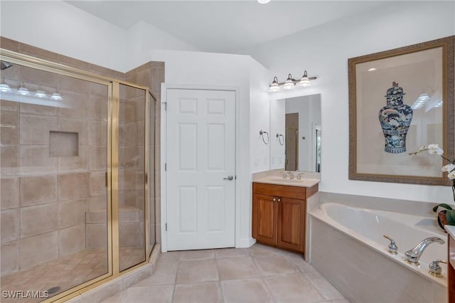 bathroom with tile patterned flooring, vanity, and separate shower and tub