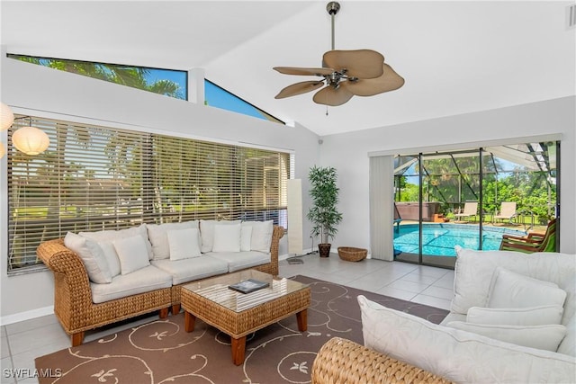 tiled living room featuring ceiling fan and vaulted ceiling