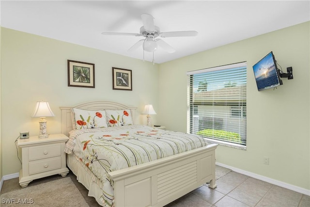 bedroom with light tile patterned floors, multiple windows, and ceiling fan