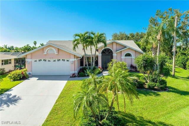 view of front of home with a garage and a front yard