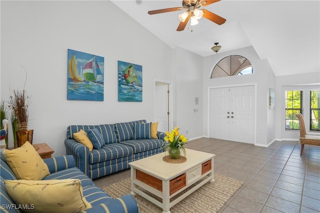 living room featuring tile patterned flooring, high vaulted ceiling, and ceiling fan