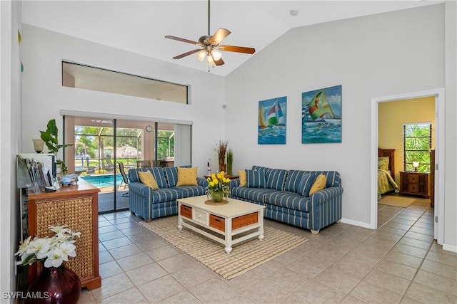 tiled living room with ceiling fan, high vaulted ceiling, and a healthy amount of sunlight