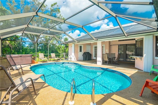 view of swimming pool with area for grilling, a lanai, a patio, and a hot tub