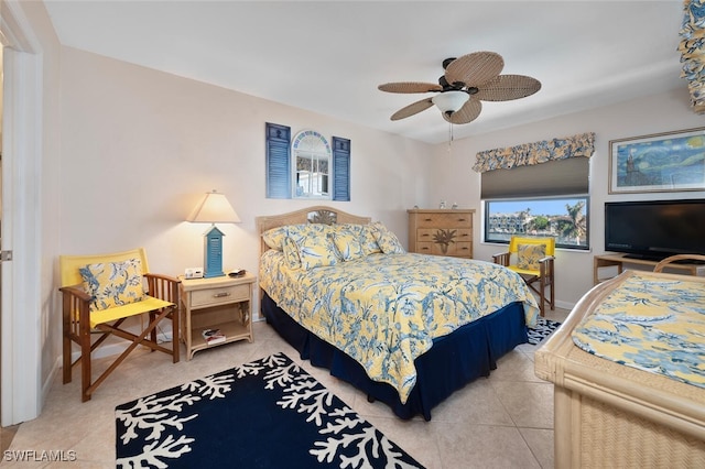 bedroom featuring tile patterned floors and ceiling fan