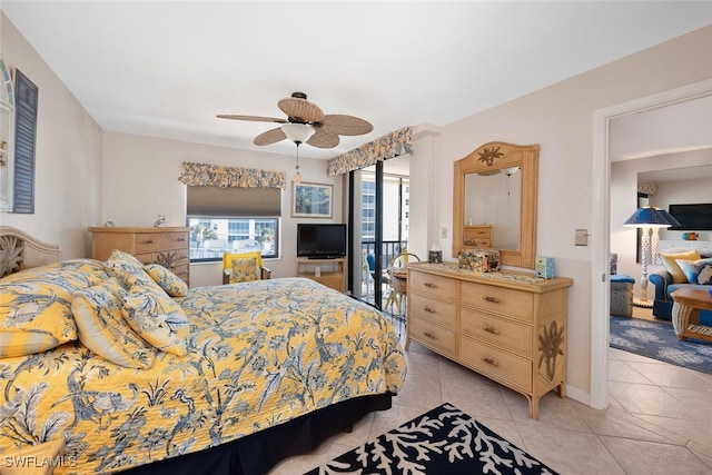 tiled bedroom featuring ceiling fan