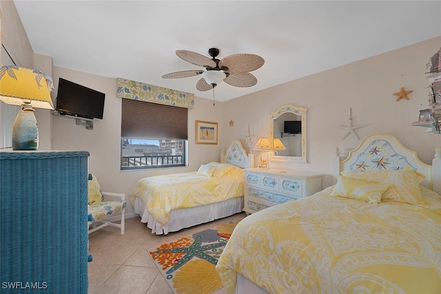 tiled bedroom featuring ceiling fan