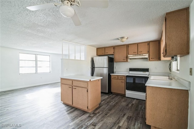 kitchen with stainless steel fridge, dark hardwood / wood-style flooring, electric range, and a textured ceiling