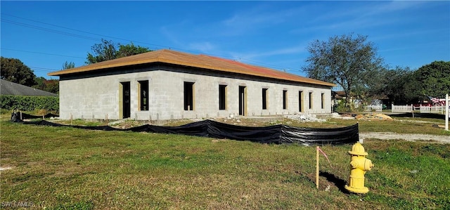 view of property exterior with a yard